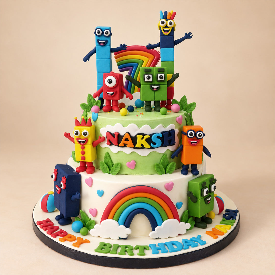 Two-Tier Numberblocks Rainbow Cake: green and white tiers with fondant Numberblocks characters and a rainbow