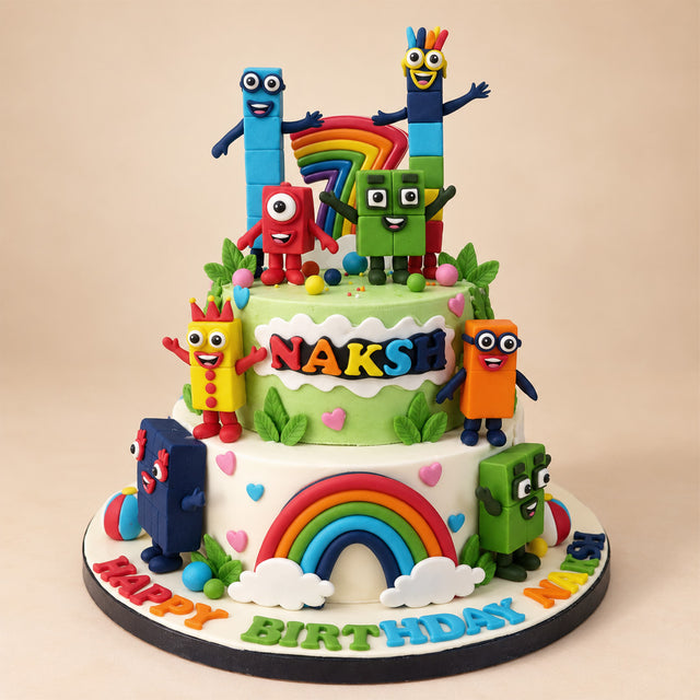 Two-Tier Numberblocks Rainbow Cake: green and white tiers with fondant Numberblocks characters and a rainbow