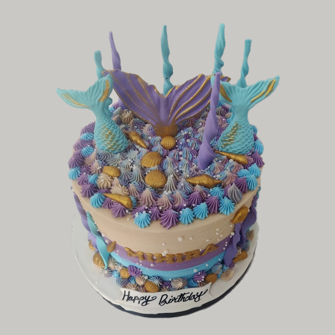 Purple and Teal Merry Mermaid Cake: buttercream with piped kisses, fondant mermaid tails and gold shells