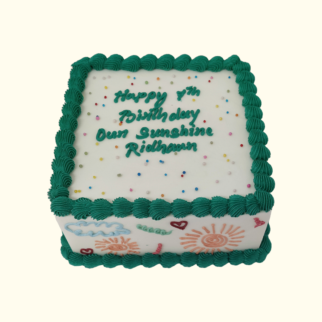 Square Green Border Doodle Birthday Cake: white buttercream with green piped borders, sprinkles and doodled suns