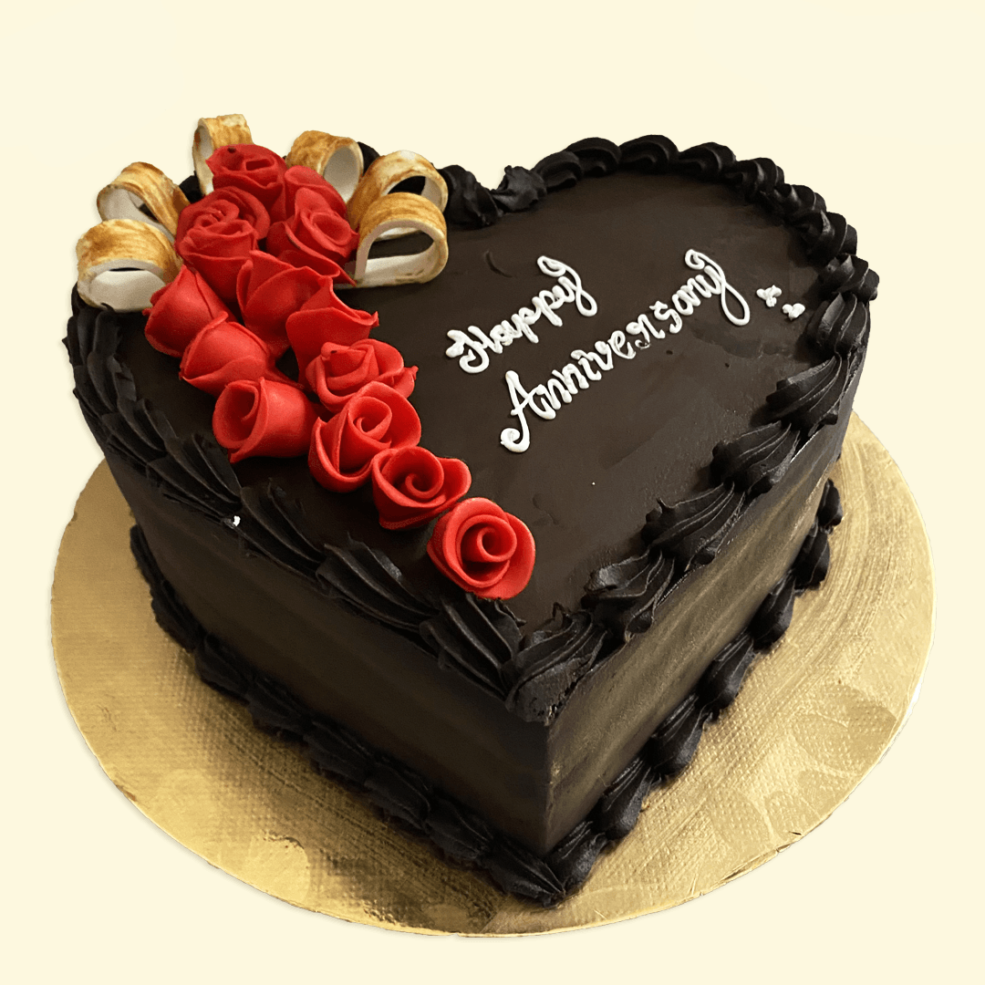 Celebrating Wedding Anniversary With Heart Shape Chocolate Cake. Stock  Photo, Picture And Royalty Free Image. Image 27408158.